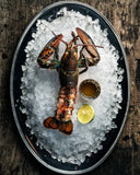 Whole Boston lobster on crushed ice with lemon and butter, seafood boil party pack delivery Singapore